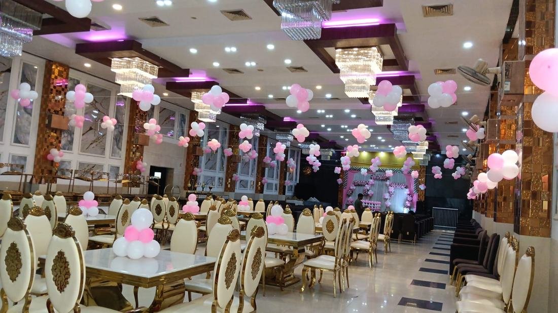 Banquet hall set for an event, gold columns and marble floor