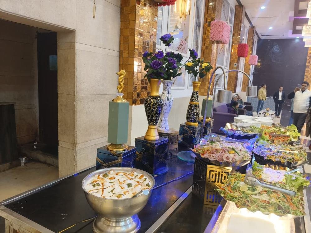 Guests gathered around a styled dessert station